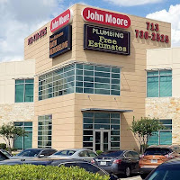 John Moore Services logo